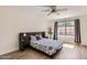 Serene main bedroom with neutral decor, wood floors, and a large window for natural light at 700 E Mesquite Cir # J135, Tempe, AZ 85288