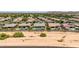 Aerial view of a neighborhood featuring a pool, beautiful backyards and desert landscaping at 7002 S Portland Ave, Gilbert, AZ 85298
