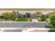 Aerial view of a single-story home with turf lawn, stone accents, and a tile roof in a suburban setting at 7002 S Portland Ave, Gilbert, AZ 85298