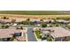 Aerial view of a quiet neighborhood with beautiful homes, green lawns and manicured landscaping at 7002 S Portland Ave, Gilbert, AZ 85298
