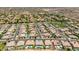 Expansive aerial view of a desert neighborhood with well-maintained homes, lush landscaping, and community amenities at 7002 S Portland Ave, Gilbert, AZ 85298
