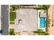 Aerial view of the backyard featuring a pool, landscaped areas, and a covered patio at 7002 S Portland Ave, Gilbert, AZ 85298