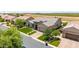 Aerial view of a single-story home highlighting the desert landscaping, walkway, and tiled roof at 7002 S Portland Ave, Gilbert, AZ 85298