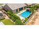 Backyard featuring a modern pool, sleek lounge chairs and lush landscaping at 7002 S Portland Ave, Gilbert, AZ 85298