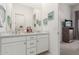 Bright bathroom featuring double sinks, ample counter space, and stylish decor, connecting seamlessly to the bedroom at 7002 S Portland Ave, Gilbert, AZ 85298