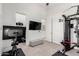 Well-lit workout room featuring neutral walls, carpet, and gym equipment for a complete home gym setup at 7002 S Portland Ave, Gilbert, AZ 85298