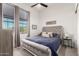 Comfortable bedroom featuring a large window, plush bedding, and stylish decor for a relaxing and inviting space at 7002 S Portland Ave, Gilbert, AZ 85298