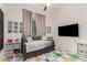 This bedroom features a comfortable trundle bed, playful decor, and is perfect for relaxation and creativity at 7002 S Portland Ave, Gilbert, AZ 85298