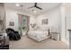 Serene primary bedroom featuring plush carpeting, neutral tones, and view to the outside at 7002 S Portland Ave, Gilbert, AZ 85298
