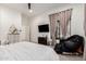 Bright and spacious bedroom with large window, plush chair and neutral decor at 7002 S Portland Ave, Gilbert, AZ 85298