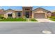 Inviting exterior featuring manicured front yard, stone accents, and well-maintained landscaping at 7002 S Portland Ave, Gilbert, AZ 85298