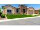 Charming single-story home with desert landscaping and a stylish stone accent entry at 7002 S Portland Ave, Gilbert, AZ 85298