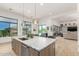 Kitchen island with stainless steel appliances, and view to the pool at 7002 S Portland Ave, Gilbert, AZ 85298