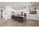 Modern kitchen featuring a large island, stainless steel appliances, and stylish pendant lighting at 7002 S Portland Ave, Gilbert, AZ 85298