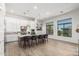 Spacious kitchen with a large island, wood floors, pendant lights, and a view to the outside at 7002 S Portland Ave, Gilbert, AZ 85298