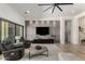 Modern living room design with a sleek entertainment center and cozy seating area at 7002 S Portland Ave, Gilbert, AZ 85298