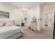 Bright main bedroom featuring neutral colors and an attached bathroom for a seamless and luxurious living experience at 7002 S Portland Ave, Gilbert, AZ 85298