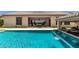 Gorgeous pool and backyard featuring an outdoor kitchen and relaxing patio space at 7002 S Portland Ave, Gilbert, AZ 85298