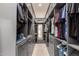 Spacious walk-in closet with custom shelving and ample storage for an organized wardrobe at 7002 S Portland Ave, Gilbert, AZ 85298