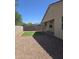 Low maintenance backyard with artificial turf, gravel landscaping, block wall, and covered patio at 7321 N 123Rd Dr, Glendale, AZ 85307