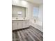 Bathroom featuring a double sink vanity, and a tub at 7321 N 123Rd Dr, Glendale, AZ 85307