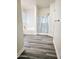 Bright bathroom featuring a tub, and glass shower, and sleek gray flooring at 7321 N 123Rd Dr, Glendale, AZ 85307