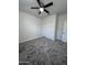 Bedroom with a ceiling fan and a closet with sliding doors at 7321 N 123Rd Dr, Glendale, AZ 85307