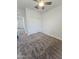 Bedroom with neutral carpet, a ceiling fan, and closet with sliding doors at 7321 N 123Rd Dr, Glendale, AZ 85307