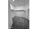 Walk-in closet space with carpet and closet rod, ready for storage at 7321 N 123Rd Dr, Glendale, AZ 85307