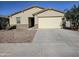 Charming single-story home featuring a two-car garage and low maintenance desert landscaping at 7321 N 123Rd Dr, Glendale, AZ 85307