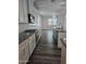 Gourmet kitchen with granite countertops, stainless appliances, and ample storage and counter space at 7321 N 123Rd Dr, Glendale, AZ 85307