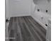 Laundry room featuring gray wood-look flooring and modern storage at 7321 N 123Rd Dr, Glendale, AZ 85307