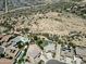 Expansive aerial view of a neighborhood with homes, pools, desert landscape and walking paths for active outdoor lifestyle at 7398 W Paso Trl, Peoria, AZ 85383