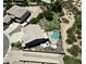 Aerial view of a home with a pool, patio, large yard, desert landscaping, and neighboring properties at 7398 W Paso Trl, Peoria, AZ 85383
