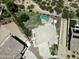 Aerial view of a home with a pool, patio, large yard, and views of neighboring homes at 7398 W Paso Trl, Peoria, AZ 85383