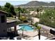 View of a backyard pool with mountain views and privacy fence at 7398 W Paso Trl, Peoria, AZ 85383