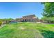 Large backyard area with the desert style home, pool, and desert landscaping at 7398 W Paso Trl, Peoria, AZ 85383