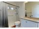 This bathroom features a shower, toilet, vanity, mirror and granite countertop at 7398 W Paso Trl, Peoria, AZ 85383