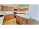 Modern kitchen featuring black appliances, an island, and ample cabinet space for storage at 7398 W Paso Trl, Peoria, AZ 85383
