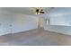 Upstairs living room with a ceiling fan and interior doors at 7398 W Paso Trl, Peoria, AZ 85383