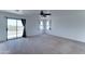 Upstairs living room with sliding glass door access to a balcony and bay windows at 7398 W Paso Trl, Peoria, AZ 85383