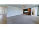 Inviting living room with plush carpet, tile entry, neutral walls, and plenty of windows, creating a warm and bright space at 7398 W Paso Trl, Peoria, AZ 85383