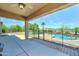 View of backyard with covered patio and gated pool at 7398 W Paso Trl, Peoria, AZ 85383