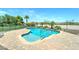 Beautiful backyard pool with stone surround and desert landscaping at 7398 W Paso Trl, Peoria, AZ 85383