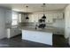 Modern kitchen featuring white cabinetry, a center island, and stainless steel appliances at 804 W Lark Dr, Queen Creek, AZ 85140
