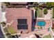 Bird's-eye view of a home with a solar panel, swimming pool, grass lawn, and patio area at 818 E Hiddenview Dr, Phoenix, AZ 85048