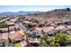 Stunning aerial view of a neighborhood with lush landscaping and mountain views in the background at 818 E Hiddenview Dr, Phoenix, AZ 85048