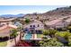 A backyard view of a home with a pool, green lawn and lush landscaping at 818 E Hiddenview Dr, Phoenix, AZ 85048