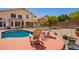 Relaxing backyard view with a refreshing pool, comfortable lounge chairs, and mature landscaping at 818 E Hiddenview Dr, Phoenix, AZ 85048