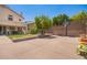 Expansive backyard featuring a sport court, green lawn, and covered patio for outdoor enjoyment at 818 E Hiddenview Dr, Phoenix, AZ 85048